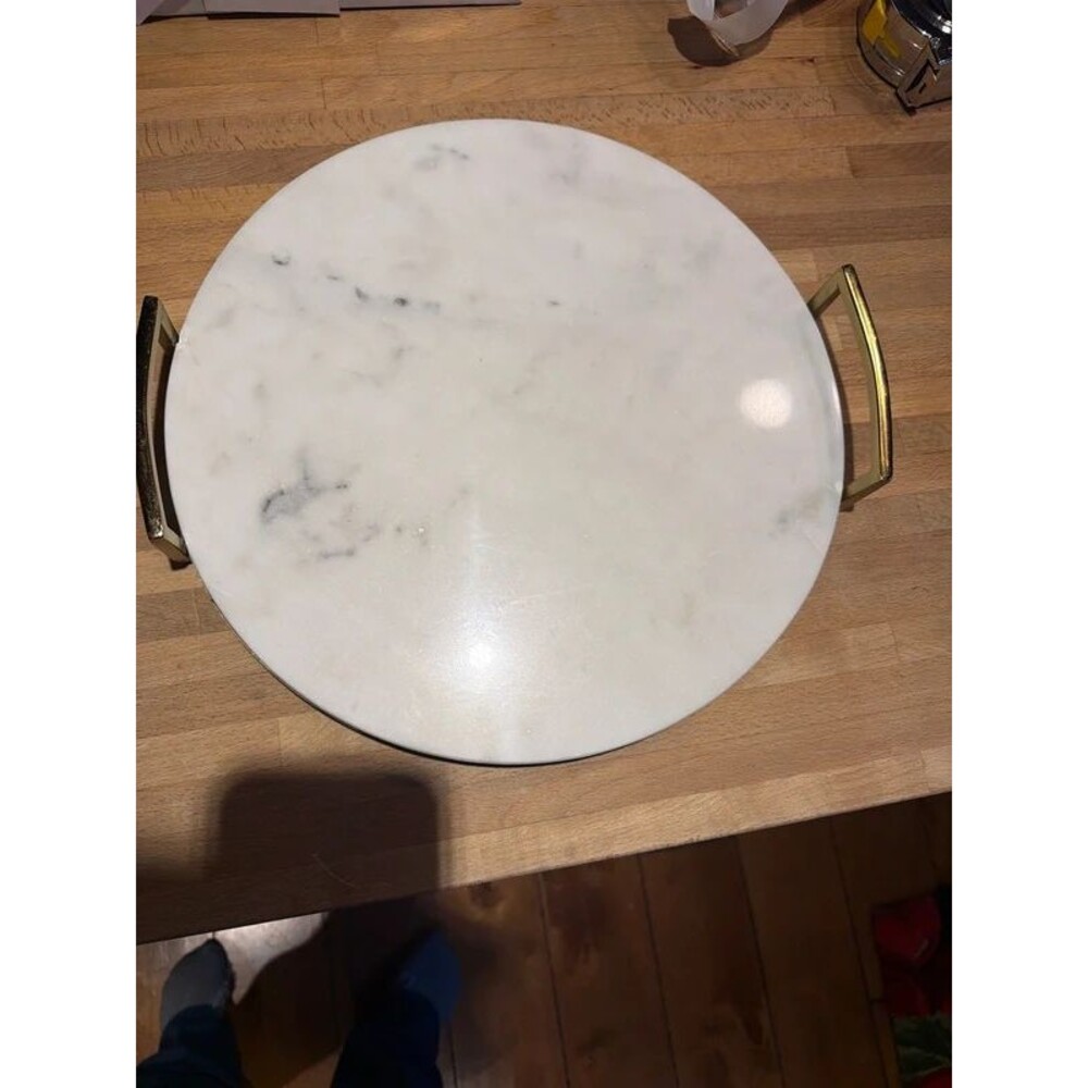 Round marble tray with gold metal handles